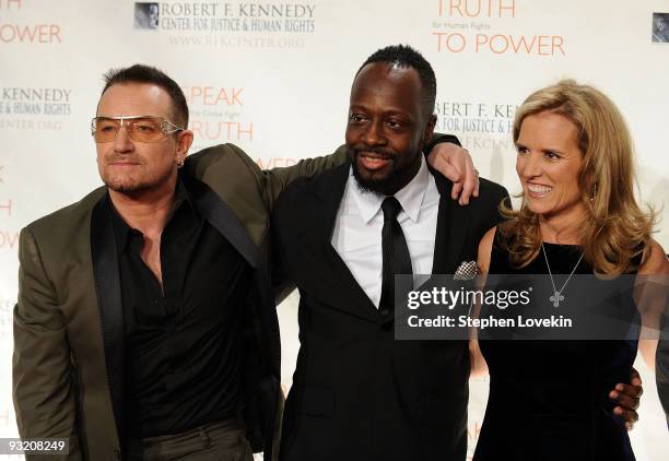 Singer Bono, singer/musician Wyclef Jean, and Kerry Kennedy attend the RFK Center Ripple of Hope Awards dinner at Pier Sixty at Chelsea Piers on...