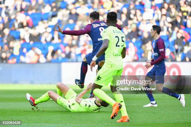 Thiago Motta of PSG lands with his studs on Romain Thomas of Angers and receives a red card during the Ligue 1 match between Paris Saint Germain and...