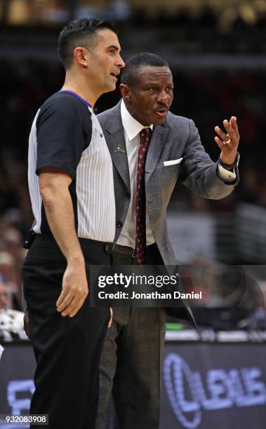 Head coach Dwane Casey argues with referee Zach Zarba during a game against the Chicago Bulls at the United Center on February 14, 2018 in Chicago,...