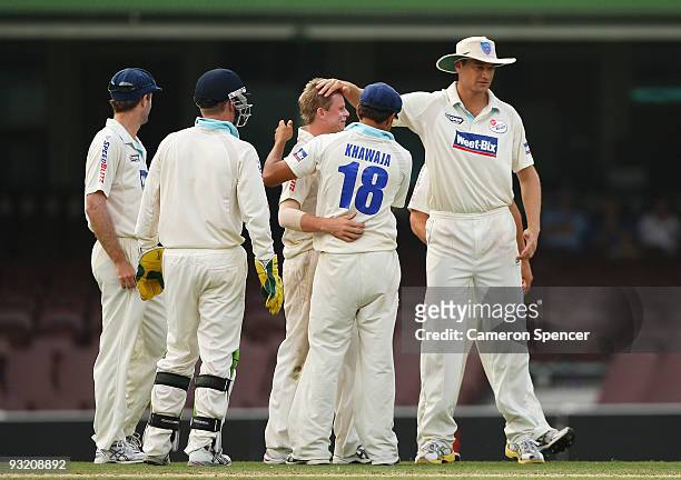 Steven Smith of the Blues is congratulated by team mates after dismissing Daniel Marsh of the Tigers during day three of the Sheffield Shield match...