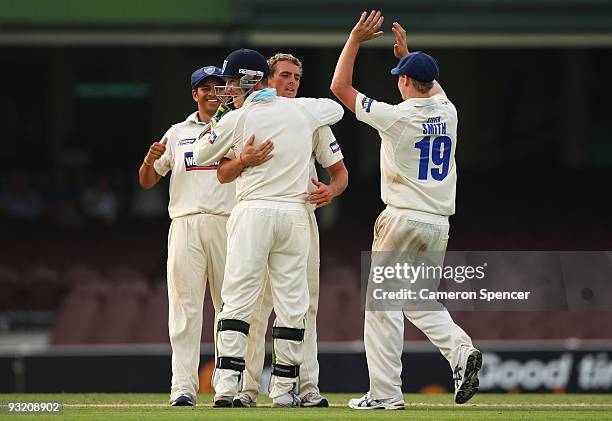 Steve O'Keefe of the Blues celebrates with Brad Haddin after dismissing Luke Butterworth of the Tigers during day three of the Sheffield Shield match...