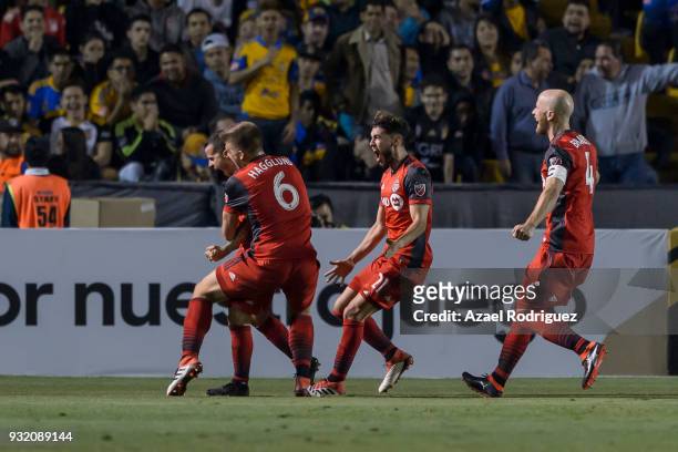 Sebastian Giovinco of Toronto celebrates with teammates after scoring his team's second goal during the quarterfinals second leg match between Tigres...