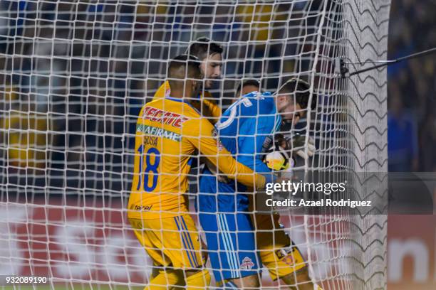 Players of Tigres argue for the ball with Alex Bono, goalkeeper of Toronto, after a goal scored by Eduardo Vargas of Tigres during the quarterfinals...