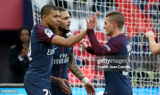 Kylian Mbappe of PSG celebrates his second goal with Layvin Kurzawa, Marco Verratti during the French Ligue 1 match between Paris Saint Germain and...