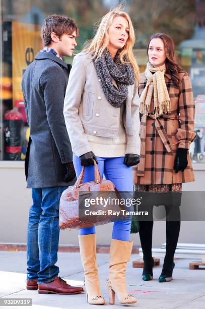 Actors Chace Crawford, Blake Lively, and Leighton Meester film scene on location on the "Gossip Girl" film set in Midtown Manhattan on November 18,...