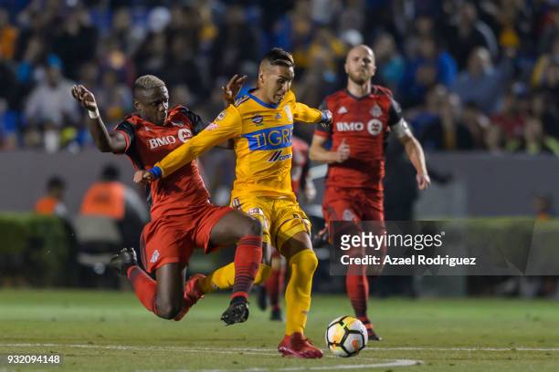 Ismael Sosa of Tigres fights for the ball with Chrys Mavinga of Toronto during the quarterfinals second leg match between Tigres UANL and Toronto FC...