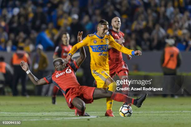 Ismael Sosa of Tigres fights for the ball with Chrys Mavinga of Toronto during the quarterfinals second leg match between Tigres UANL and Toronto FC...