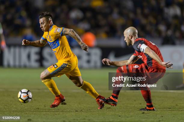 Eduardo Vargas of Tigres fights for the ball with Michael Bradley of Toronto during the quarterfinals second leg match between Tigres UANL and...