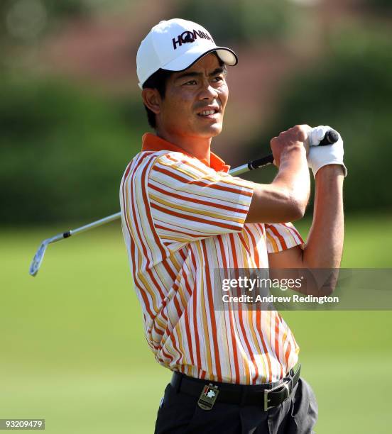 Liang Wen-chong of China hits his second shot on the tenth hole during the first round of the Dubai World Championship on the Earth Course, Jumeirah...