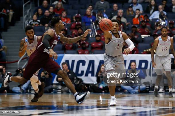 Jordan Perkins of the North Carolina Central Eagles battles for the ball against Donte Clark of the Texas Southern Tigers in the first half during...