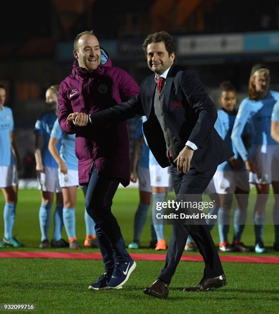 Joe Montemurro the Manager of Arsenal Women shakes hands with Nick Cushing the Manager of Manchester City Ladies before the match between Arsenal...