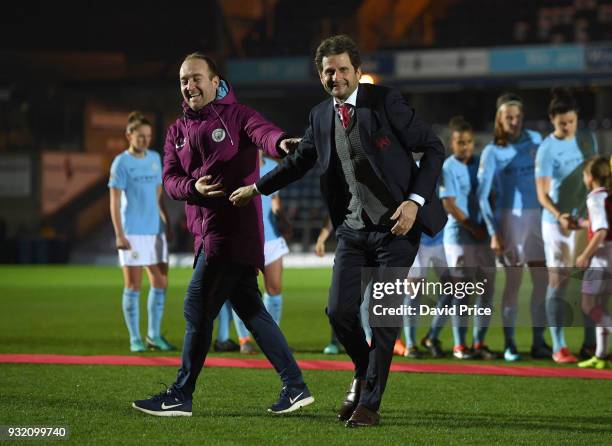 Joe Montemurro the Manager of Arsenal Women shakes hands with Nick Cushing the Manager of Manchester City Ladies before the match between Arsenal...