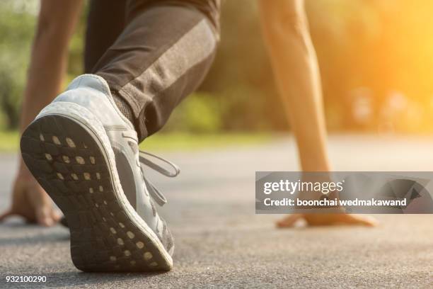 runner feet running on road closeup on shoe. - marathon winner stock pictures, royalty-free photos & images