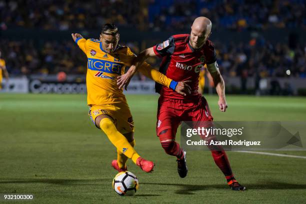 Ismael Sosa of Tigres fights for the ball with Michael Bradley of Toronto during the quarterfinals second leg match between Tigres UANL and Toronto...