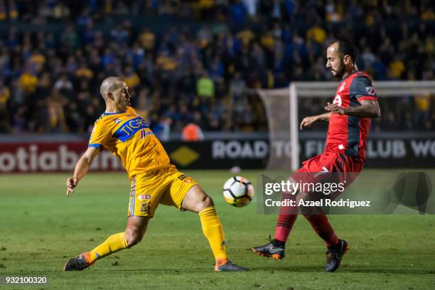 Jorge Torres of Tigres fights for the ball with Victor Vazquez of Toronto during the quarterfinals second leg match between Tigres UANL and Toronto...