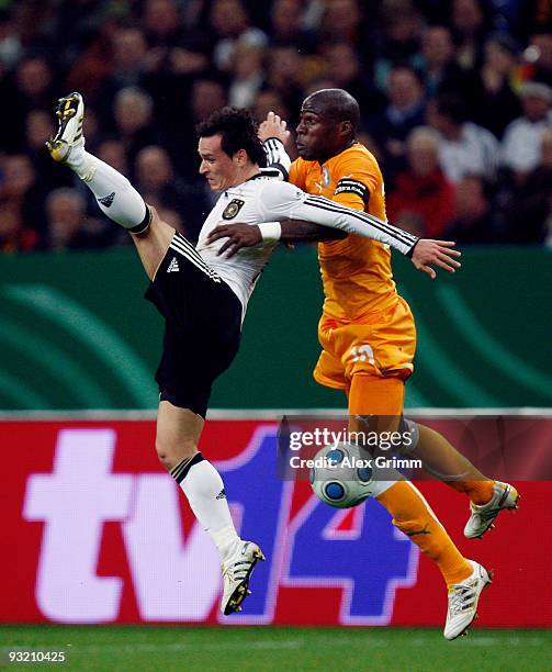 Piotr Trochowski of Germany jumps for a header with Guy Demel of Ivory Coast during the International friendly match between Germany and the Ivory...