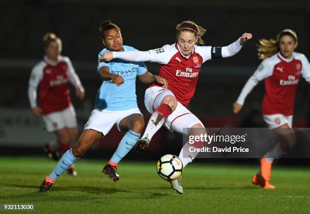 Kim Little of Arsenal is challenged by Nikita Parris of Man City during the match between Arsenal Women and Manchester City Ladies at Adams Park on...