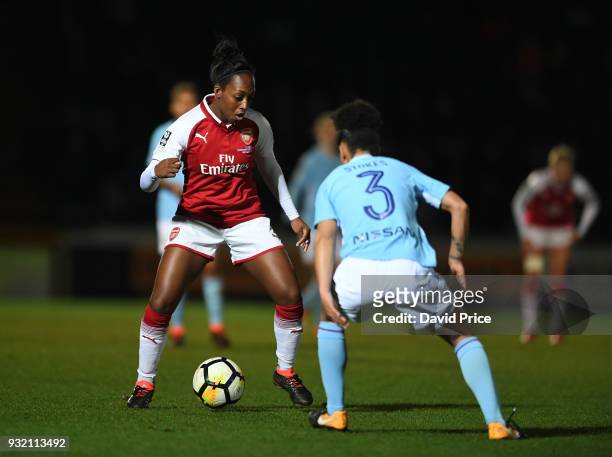 Danielle Carter of Arsenal takes on Demi Stokes of Man City during the match between Arsenal Women and Manchester City Ladies at Adams Park on March...