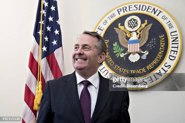 Liam Fox, U.K. International trade secretary, smiles while standing before a bilateral meeting with Robert Lighthizer, U.S. Trade representative, not...