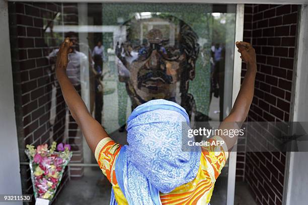 Bangladeshi woman expresses her emotions at the former residence of Bangladesh�s founding president Sheikh Mujibur Rahman, which is now a museum in...