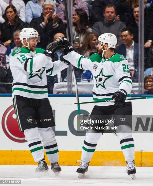 Radek Faksa of the Dallas Stars is congratulated by teammate Greg Pateryn after scoring on the Toronto Maple Leafs during the first period at the Air...