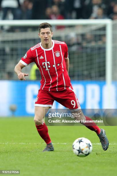 Robert Lewandowski of FC Bayern Muenchen runs with the ball during the UEFA Champions League Round of 16 Second Leg match Besiktas and Bayern...