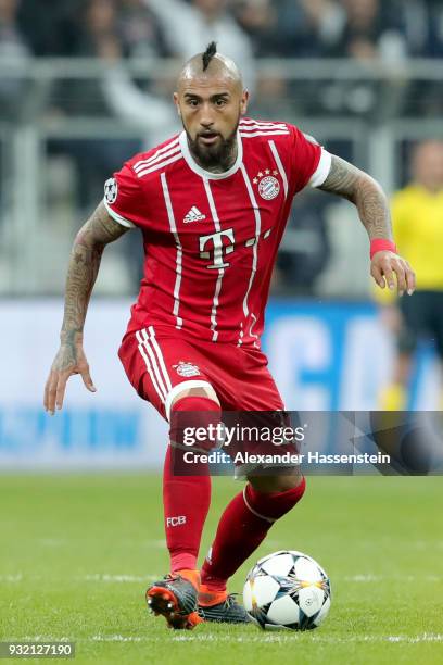 Arturo Vidal of FC Bayern Muenchen runs with the ball during the UEFA Champions League Round of 16 Second Leg match Besiktas and Bayern Muenchen at...