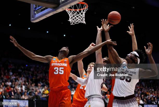 Bourama Sidibe of the Syracuse Orange battles for the ball with Mickey Mitchell and De'Quon Lake of the Arizona State Sun Devils in the first half...