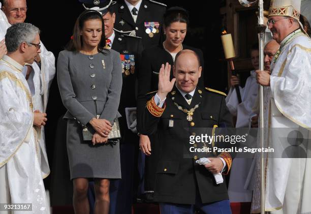 Prince Albert II of Monaco is followed by Princess Stephanie of Monaco and Princess Caroline of Hanover as they leave the Cathedral after attending...