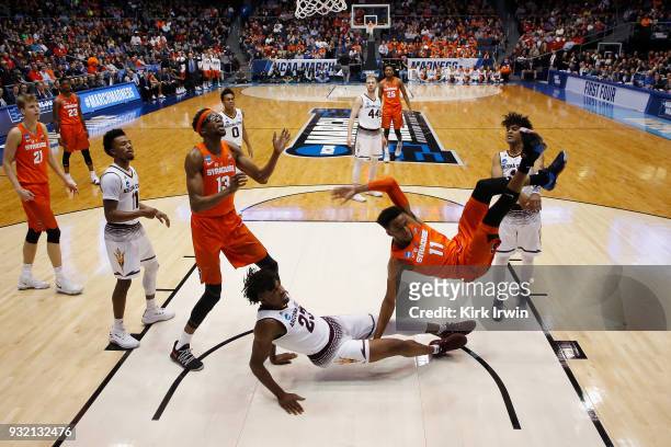 Oshae Brissett of the Syracuse Orange falls after driving to the basket in the first half against the Arizona State Sun Devils during the First Four...