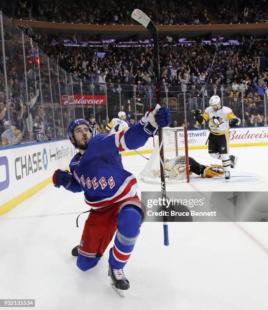 Mika Zibanejad of the New York Rangers celebrates his game winning goal at 2:53 of overtime against the Pittsburgh Penguins at Madison Square Garden...