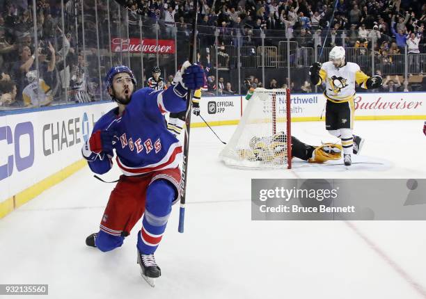 Mika Zibanejad of the New York Rangers celebrates his game winning goal at 2:53 of overtime against the Pittsburgh Penguins at Madison Square Garden...