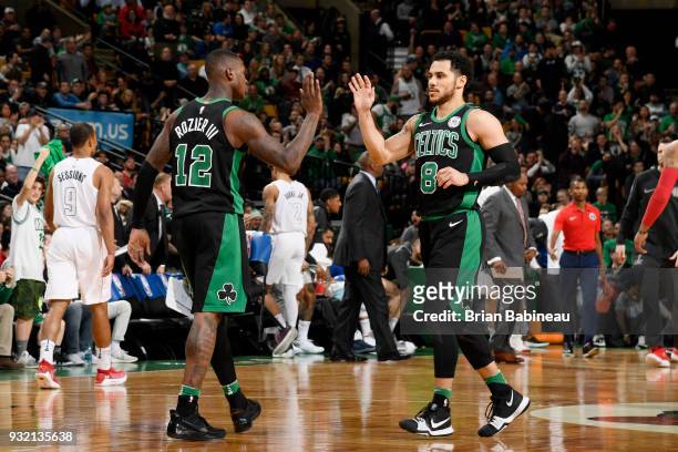 Terry Rozier and Shane Larkin of the Boston Celtics high five during the game against the Washington Wizards on March 14, 2018 at the TD Garden in...