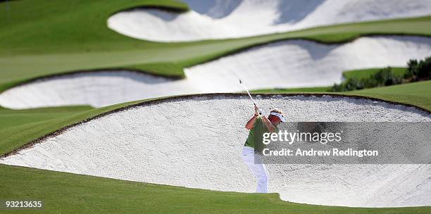 Peter Hedblom of Sweden hits his second shot on the 16th hole during the first round of the Dubai World Championship on the Earth Course, Jumeirah...