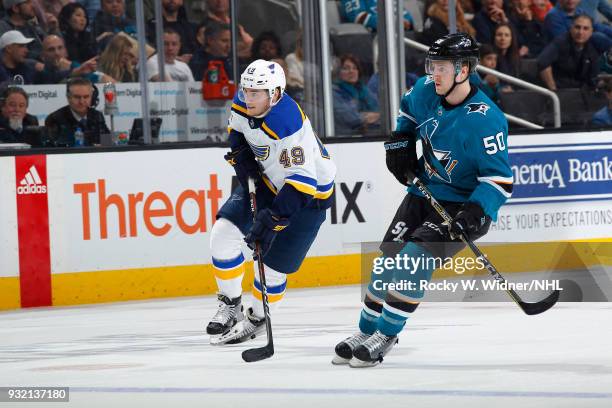Ivan Barbashev of the St. Louis Blues skates against Chris Tierney of the San Jose Sharks at SAP Center on March 8, 2018 in San Jose, California....