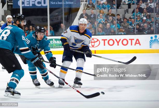 Jaden Schwartz of the St. Louis Blues clears the puck against Timo Meier of the San Jose Sharks at SAP Center on March 8, 2018 in San Jose,...