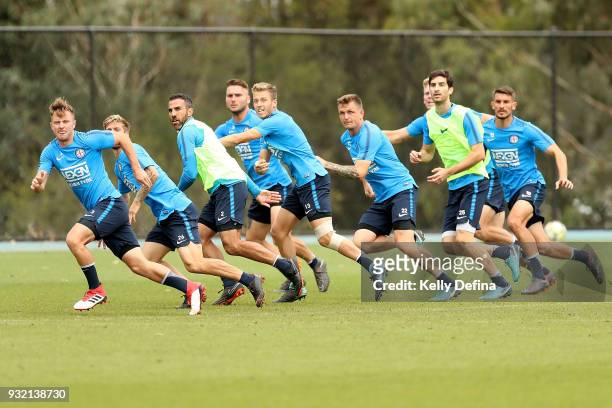 Scott Jamieson and Melbourne City players run during a drill at a Melbourne City FC A-League training session at City Football Academy on March 15,...