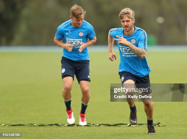 Luke Brattan and Scott Jamieson of Melbourne City run during an agility drill at a Melbourne City FC A-League training session at City Football...