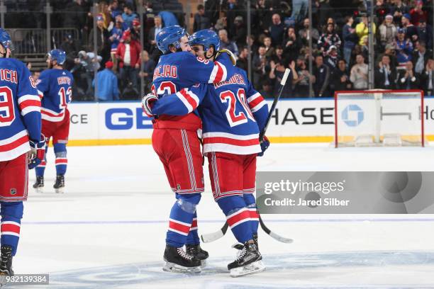 Mika Zibanejad and Chris Kreider of the New York Rangers celebrate after defeating the Pittsburgh Penguins 4-3 in overtime at Madison Square Garden...