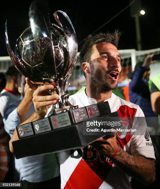 Ignacio Scocco of River Plate celebrates with the Supercopa Argentina 2018 throphy after winning the final match against Boca Juniors at Malvinas...