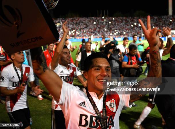 River Plate's Enzo Perez celebrates after winning the Supercopa Argentina 2018 after defeating Boca Junior's in the final football match at Malvinas...