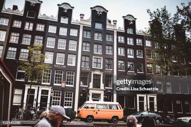 orange vw bulli in amsterdam - bulli stock pictures, royalty-free photos & images