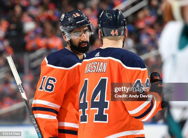 Jujhar Khaira and Zack Kassian of the Edmonton Oilers discuss the play during the game against the San Jose Sharks on March 14, 2018 at Rogers Place...