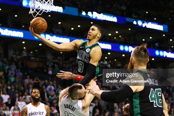 Jayson Tatum of the Boston Celtics goes up for a layup in the fourth quarter of a game against the Washington Wizards at TD Garden on March 14, 2018...