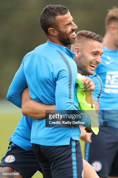 Manny Muscat and Bart Schenkeveld of Melbourne City share a joke during a break at a Melbourne City FC A-League training session at City Football...
