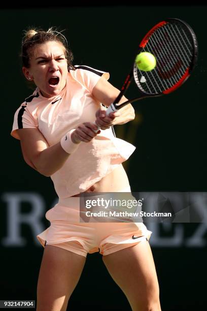 Simona Halep of Romania returns a shot to Petra Martic of Croatia during the BNP Paribas Open at the Indian Wells Tennis Garden on March 14, 2018 in...