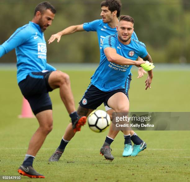 Bart Schenkeveld defends Manny Muscat both of Melbourne City as he kicks the ball during a Melbourne City FC A-League training session at City...