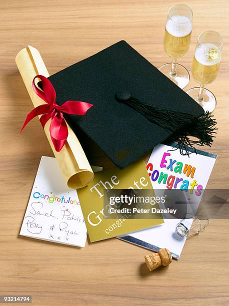 student celebrating exam success. - mortar board scroll stock pictures, royalty-free photos & images