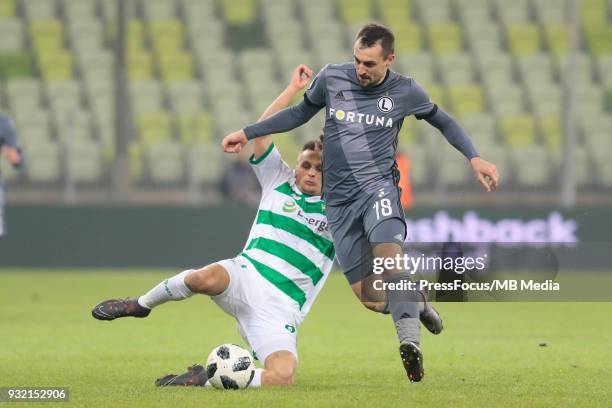 Slawomir Peszko of Lechia Gdansk competes with Michal Kucharczyk of Legia Gdansk during Lotto Ekstraklasa match between Lechia Gdansk and Legia...