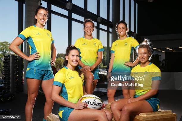 Alicia Quirk, Charlotte Caslick, Evania Pelite, Dominique Du Toit and Emma Tonegato of the Australian Women's Sevens team pose during the Australian...